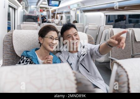 Happy elderly couple take the subway Stock Photo
