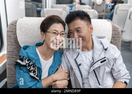 Happy elderly couple take the subway Stock Photo
