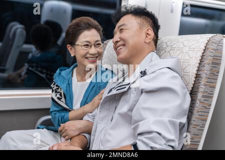 Happy elderly couple take the subway Stock Photo