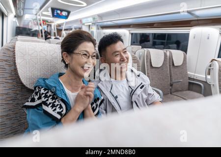 Happy elderly couple take the subway Stock Photo