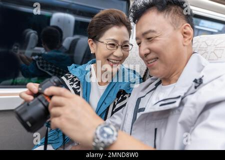 Happy elderly couple take the subway Stock Photo