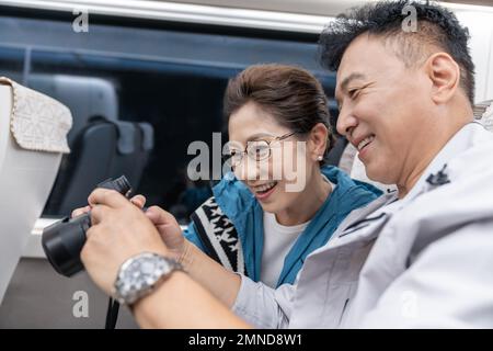 Happy elderly couple take the subway Stock Photo