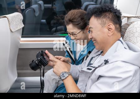 Happy elderly couple take the subway Stock Photo
