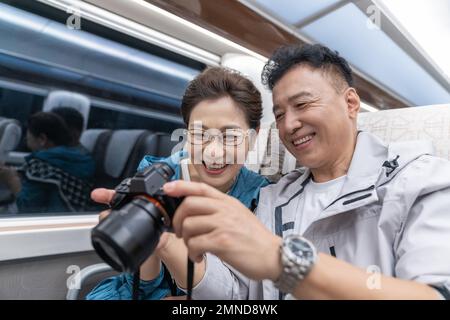 Happy elderly couple take the subway Stock Photo