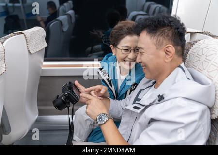 Happy elderly couple take the subway Stock Photo