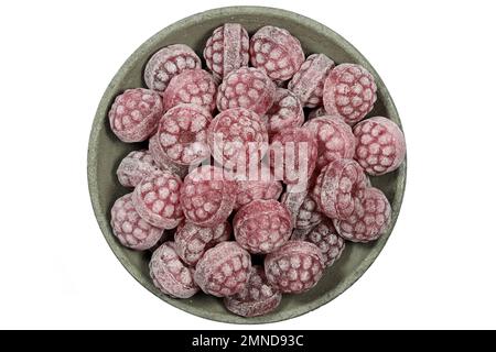 raspberry candies in a concrete bowl isolated on white background Stock Photo
