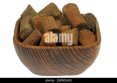 Dutch cinnamon candy sticks in a teakwood bowl isolated on white background Stock Photo