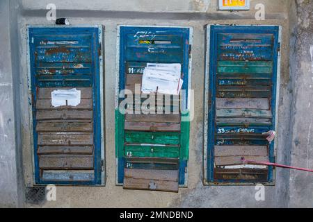 ODESSA, UKRAINE - APR 29, 2019: Group of mailboxes with bundles of receipts in an abandoned municipal house, Odessa, Ukraine Stock Photo