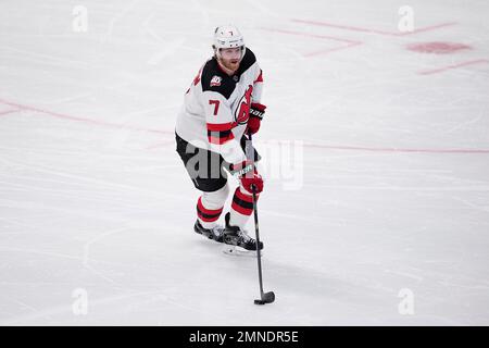New Jersey Devils defenseman Dougie Hamilton (7) celebrates with teammates  after scoring a goal against the Chicago Blackhawks during the first period  of an NHL hockey game Friday, Oct. 15, 2021, in