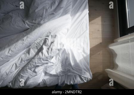 top view of messy bed in early morning , messy bed after waking up  Stock Photo