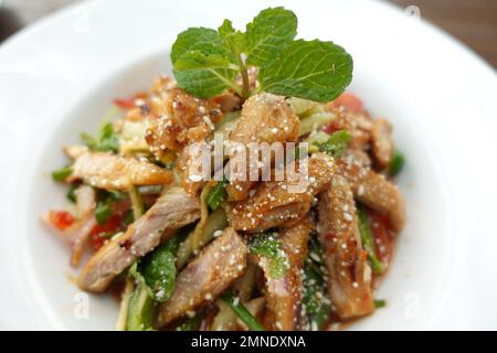 Caesar Salad in a bowl on table, Stock Photo