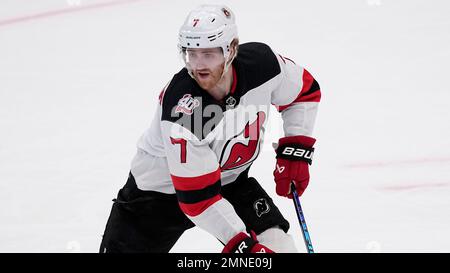 New Jersey Devils defenseman Dougie Hamilton (7) celebrates with teammates  after scoring a goal against the Chicago Blackhawks during the first period  of an NHL hockey game Friday, Oct. 15, 2021, in