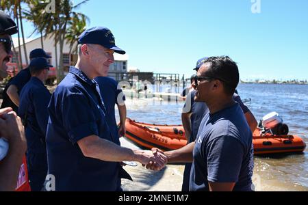 Vice Adm. Kevin E. Lunday, commander, Atlantic Area, speaks with Coast Guard personnel assigned to the Gulf, Atlantic and Pacific Strike teams in Matlacha Isles, Florida, Oct. 2, 2022. Lunday visited members who responded in the wake of Hurricane Ian. U.S. Coast Guard photo by Petty Officer 3rd Class Ian Gray.