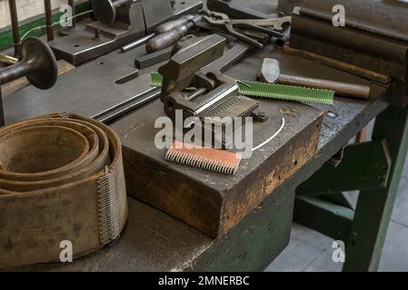 Press-in device for belt connectors in a former valve factory, now an industrial museum, Lauf an der Pegnitz, Middle Franconia, Bavaria, Germany Stock Photo