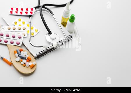 wooden spoon filled with pills stethoscope. Resolution and high quality beautiful photo Stock Photo