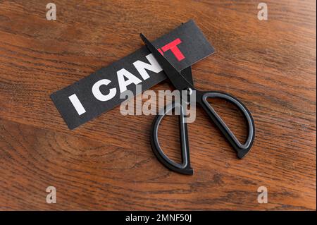 top view i cant message card being cut with scissor. High resolution photo Stock Photo