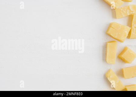 elevated view cheddar cheese slices white background. Resolution and high quality beautiful photo Stock Photo