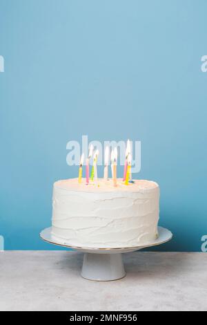 front view lit candles birthday cake. High resolution photo Stock Photo