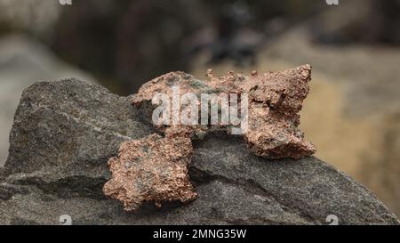 raw copper ore resting on a rock Stock Photo