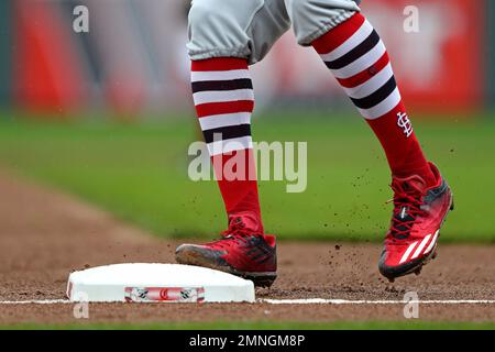 The socks and cleats worn by St. Louis Cardinals' Miles Mikolas are seen as  he throws during a baseball game against the Cincinnati Reds in Cincinnati,  Thursday, May 25, 2023. (AP Photo/Aaron
