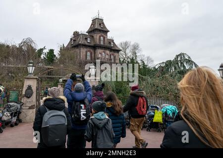 People walking to Phantom Manor Haunted House Attraction Disneyland Paris in France. Dark ride attraction in Frontierland at Disneyland Park. Stock Photo