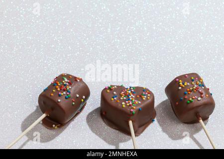 Marshmallows Covered With Chocolate And With Mini Colored Dragees. Stock Photo