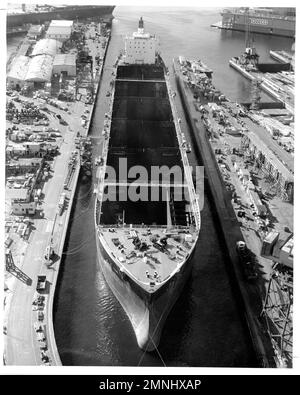 In a graving dock at the National Steel and Shipbuilding Company, San Diego, the supertanker SS Worth undergoes conversion to USNS Mercy (T-AH 19), the Navy's newest hospital ship ca. late 1970s Stock Photo