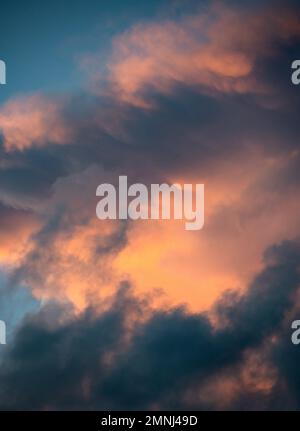 Dramatic storm clouds at sunset Stock Photo