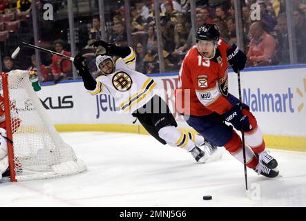 Boston Bruins' Jake DeBrusk, left, celebrates his goal with Joakim