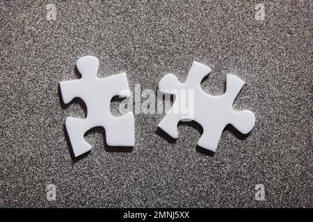 Two white jigsaw pieces Stock Photo