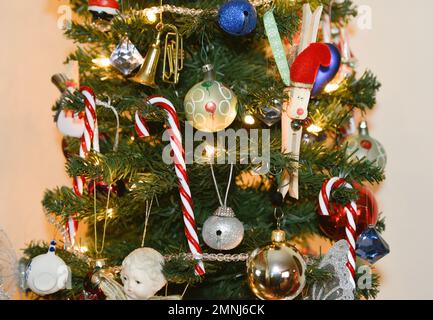 Close Up of Christmas Tree Decorated with Candy Canes and Christmas Ball Ornaments Stock Photo