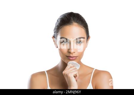 Portrait of young woman holding cotton pad Stock Photo