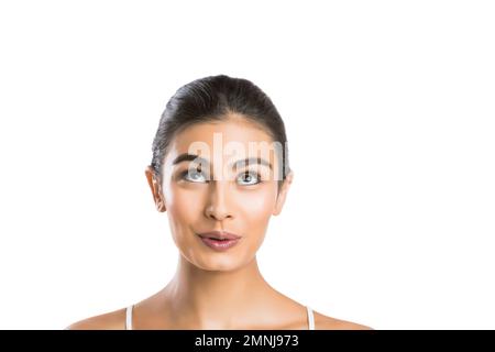 Portrait of young woman looking up Stock Photo