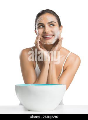 Portrait of young woman enjoying washing face Stock Photo
