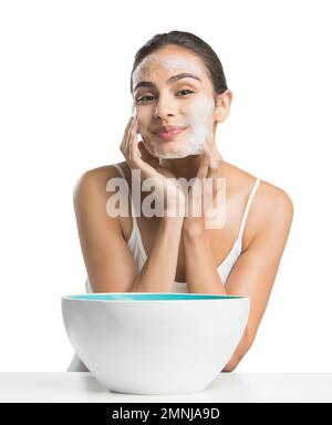 Portrait of young woman enjoying washing face Stock Photo