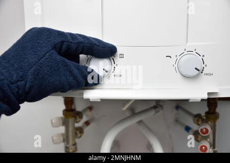 hand rotate temperature adjuster of water heater.High temp Stock Photo