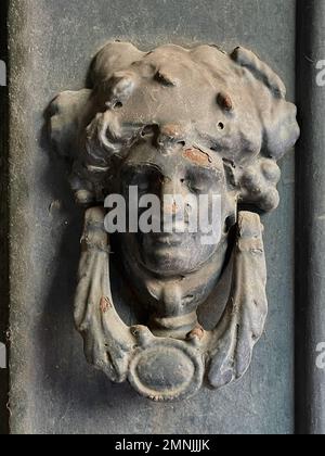 Ancient door knocker made of iron used as decoration in Portugal Stock Photo