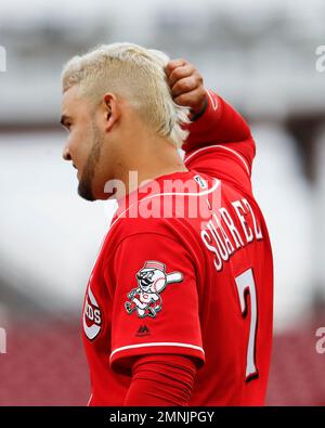 Cincinnati Reds' Eugenio Suarez (7) stands on third base with a triple as  Pittsburgh Pirates third baseman Sean Rodriguez, right, holds the late tag  during the eleventh inning of a baseball game