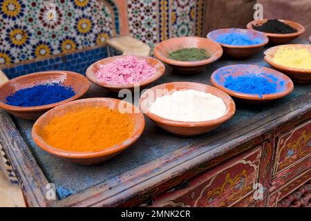 Traditional Moroccan clay bowls of colorful spices Stock Photo