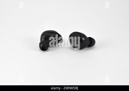 True Wireless Earphone bluetooth voice control isolated on white background. Stock Photo