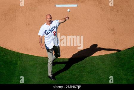 Los Angeles Dodgers Kirk Gibson raises his arm in celebration as