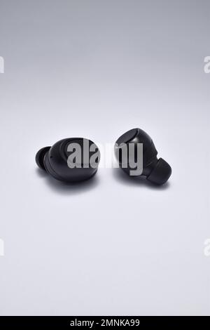 True Wireless Earphone bluetooth voice control isolated on white background. Stock Photo