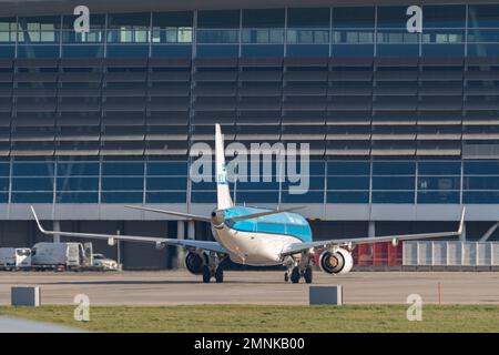 A KLM Royal Dutch Airlines Embraer E195-E2 on final approach to runway ...