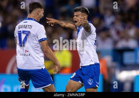 Lautaro Gianetti of Argentina's Velez Sarsfield, top, heads the