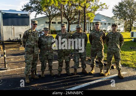 Airmen with the 255th Air Control Squadron, Mississippi Air National Guard, pose for a photo at a tactical operations center in Lehigh Acres, Florida, October 4, 2022.  The 255th is deployed to south Florida to respond to the devastation of Hurricane Ian. Stock Photo