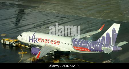 HK express airplane on the tarmac at HKIA, Hong Kong. Stock Photo