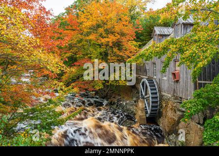 An old water mill on the Sable River with fall foliage color, Nova Scotia, Canada. Stock Photo