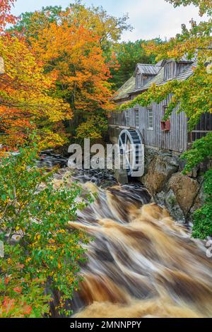 An old water mill on the Sable River with fall foliage color, Nova Scotia, Canada. Stock Photo