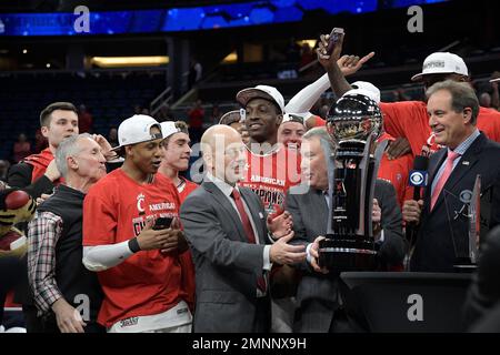 CBS Sports broadcaster Jim Nantz (left) and former Kansas Chiefs and Pro  Football Hall of Fame linebacker Bobby Bell present the Lamar Hunt trophy  after the AFC Championship against the Tennessee Titans, Sunday, Jan 19,  2020, in Kansas City, Mo