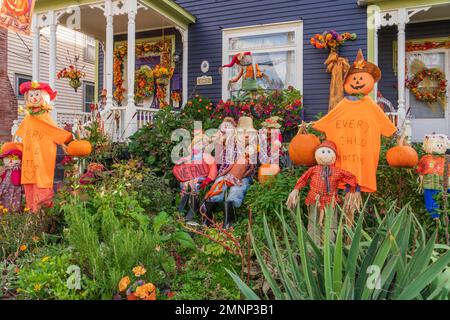 A pumpkin and scarecrow display in the front yard of a home in Truro, Nova Scotia, Canada. Stock Photo